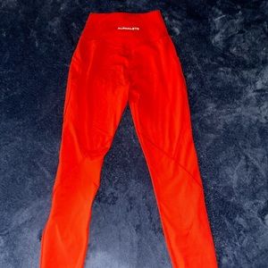 Alphalete surface path leggings, size XS, color is red